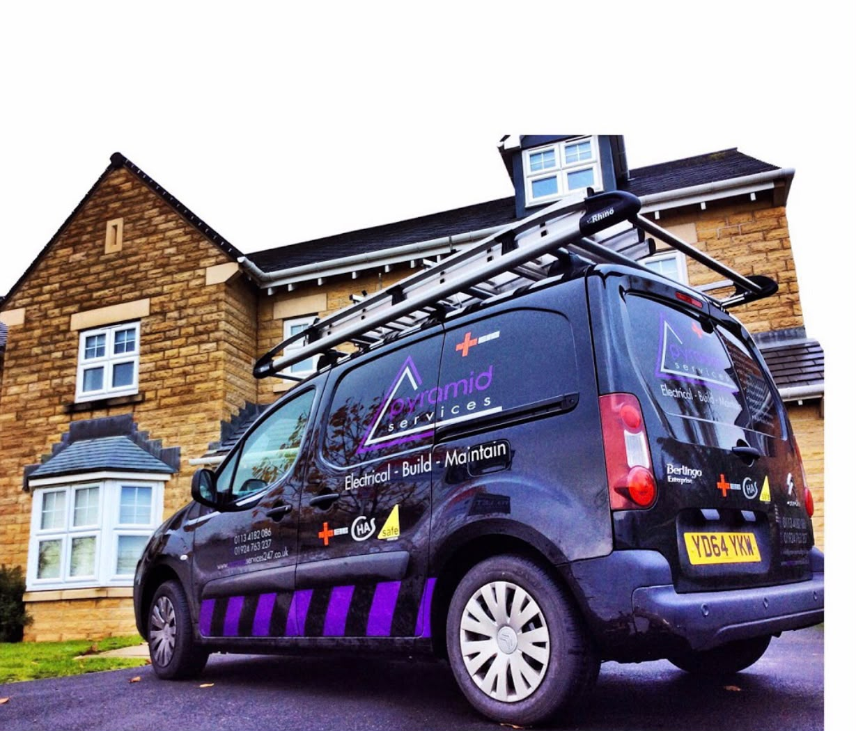 Pyramid Services van with roof ladder outside a Yorkshire home